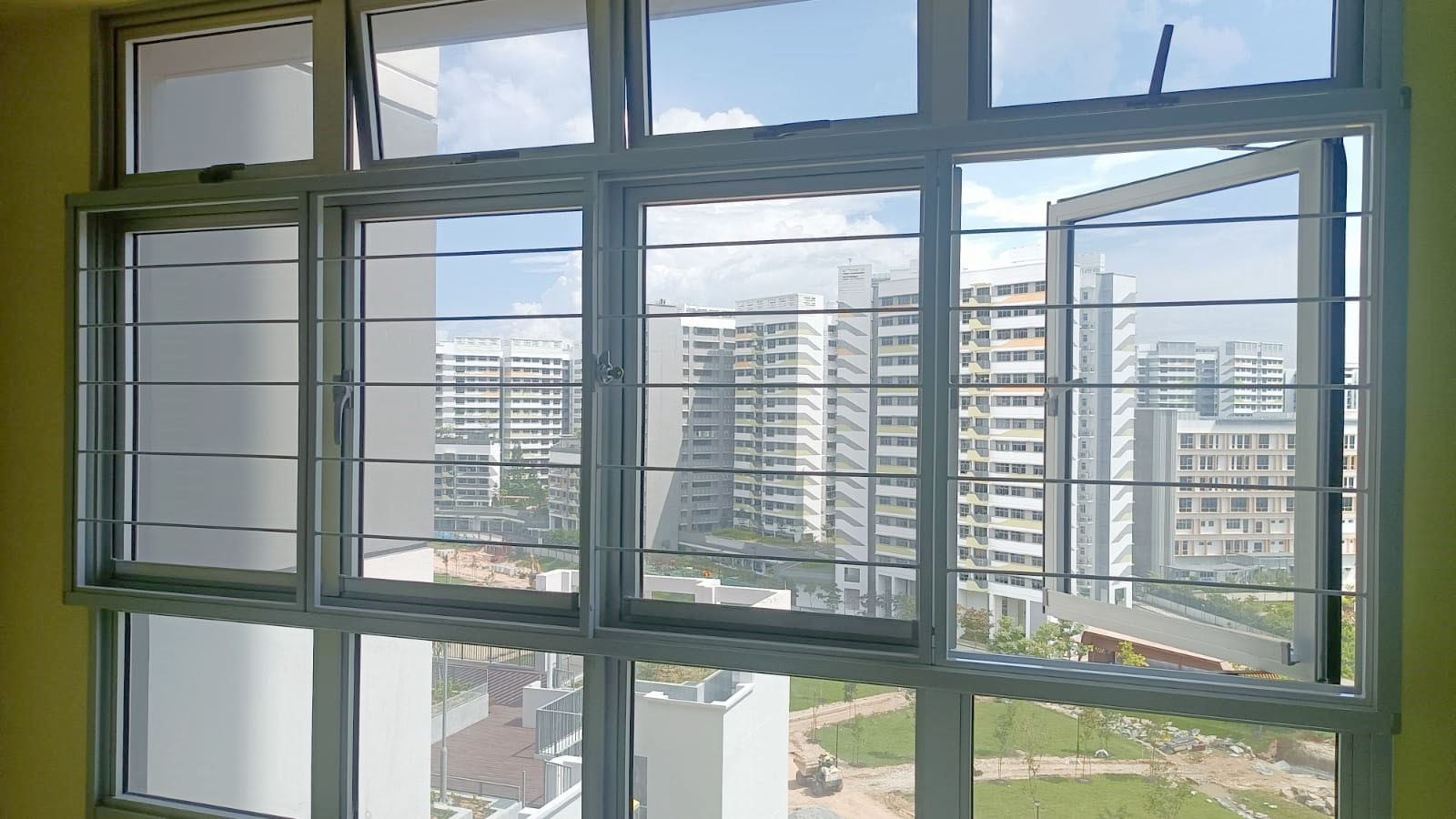 Slim window grill installation at center of window for BTO flats.